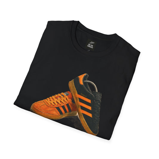 Black t-shirt with an orange retro sneaker graphic showing side and sole detail