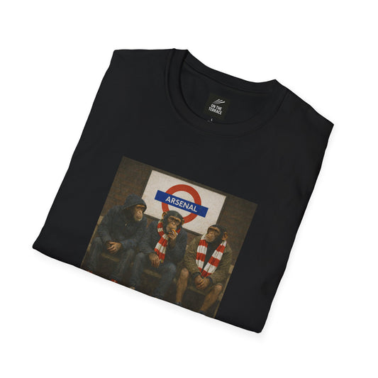 Folded black Arsenal t-shirt with a graphic of three men sitting and an Arsenal logo.