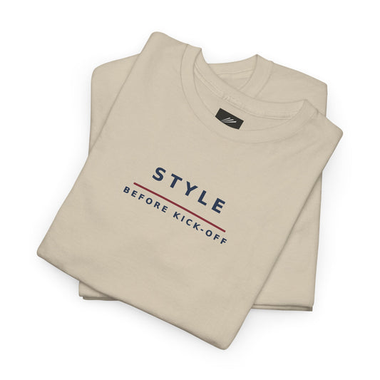 Folded sand T-shirt showing Style Before Kick-Off slogan in navy