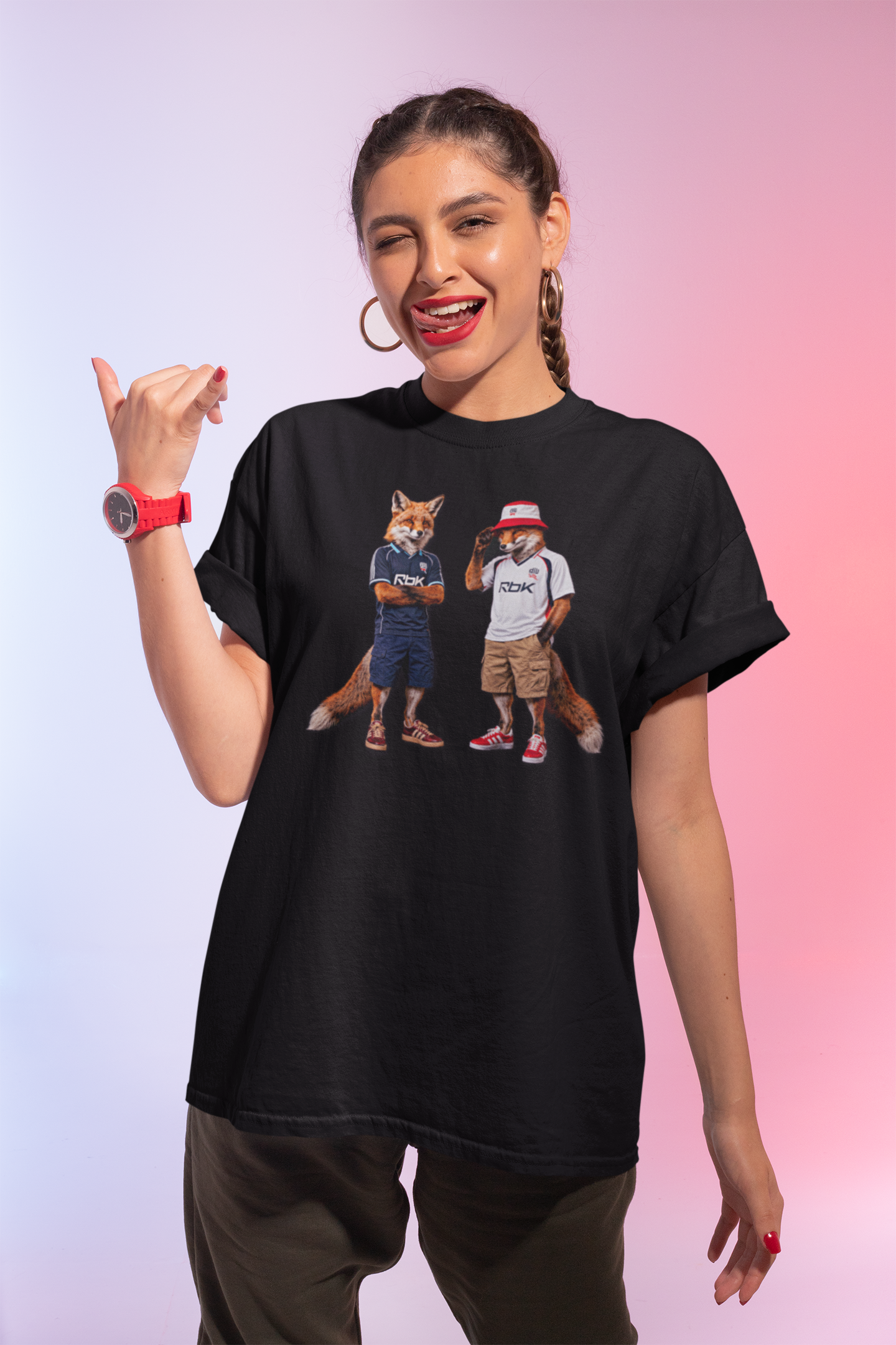 A black graphic t-shirt laid flat, featuring a central design by On The Terrace for Bolton fans. The graphic showcases two anthropomorphic English foxes dressed in vintage Rbk Bolton-inspired football kits. The fox on the left wears the dark blue retro away jersey with arms crossed, while the fox on the right sports the classic white home shirt, a red and white bucket hat, and cargo shorts. The inner neck of the tee features the official "On The Terrace" brand logo