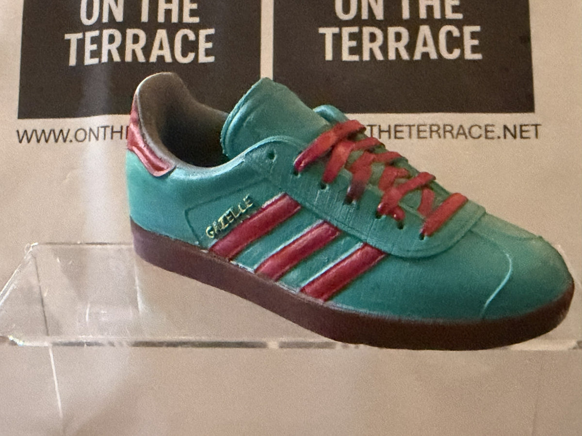Angled view of painted teal and red Gazelle inspired 120 mm model