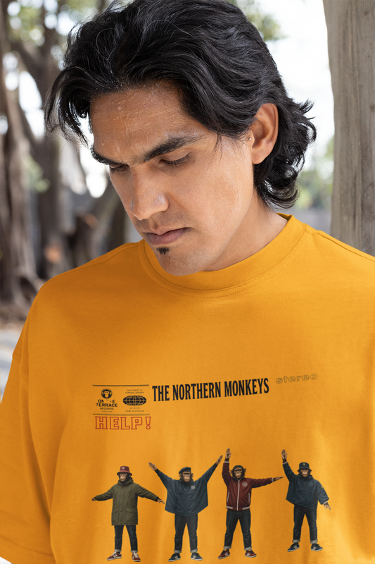 Man wearing mustard Beatles Help Casuals T-shirt in active lifestyle mockup