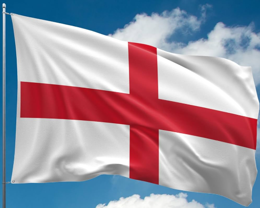Flag of England with red cross on white flying against blue sky with clouds