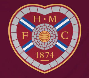 Heart-shaped maroon football crest with gold letters, cross design, and year 1874