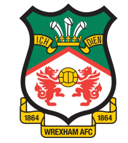 Wrexham AFC football club crest featuring red dragons, a football, and '1864' banners.
