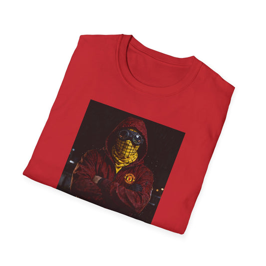 Folded Red Man United t-shirt featuring a man in a hooded jacket with goggles and a yellow mask, football casual style