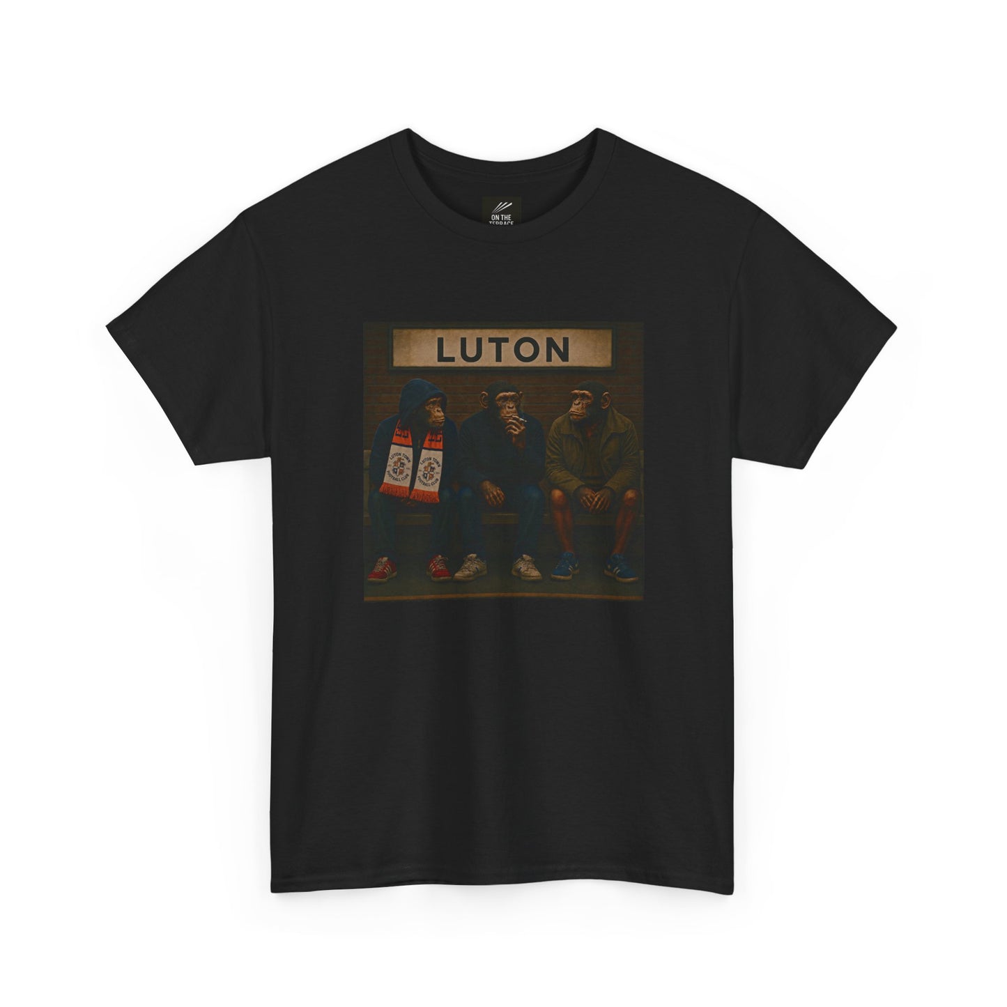 A black short-sleeve crewneck Luton t-shirt featuring a square graphic print on the chest with the word 'LUTON' above an illustration of three men sitting on a bench.
