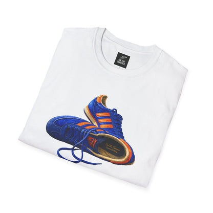 A folded white t-shirt with illustration of blue and orange adidas Gazelle-style trainers, terrace casual sneaker graphic tee, vintage trainer collection, On The Terrace