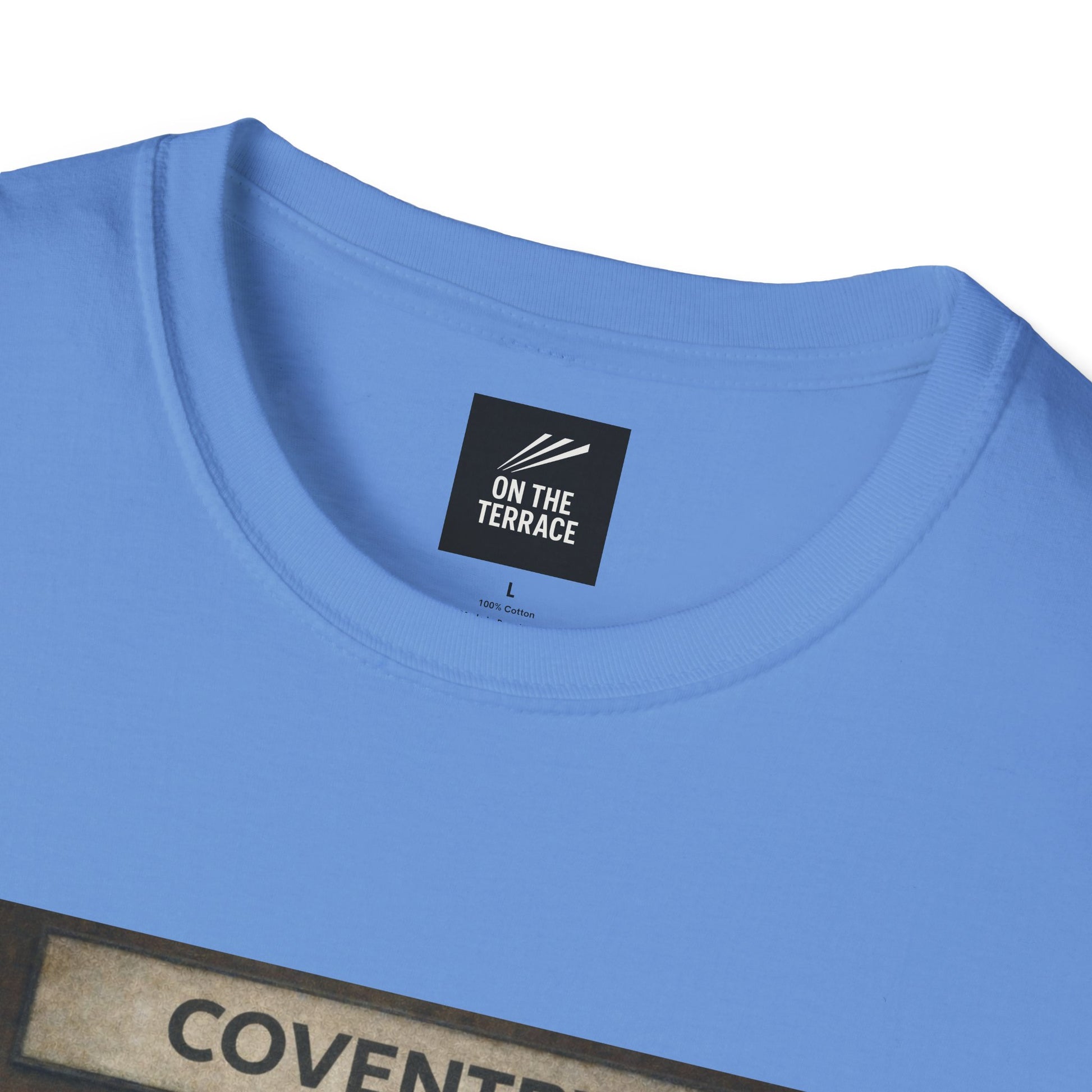 Coventry City Fan T-Shirt Close-up of a blue t-shirt with 'On the Terrace' label and partially visible text.