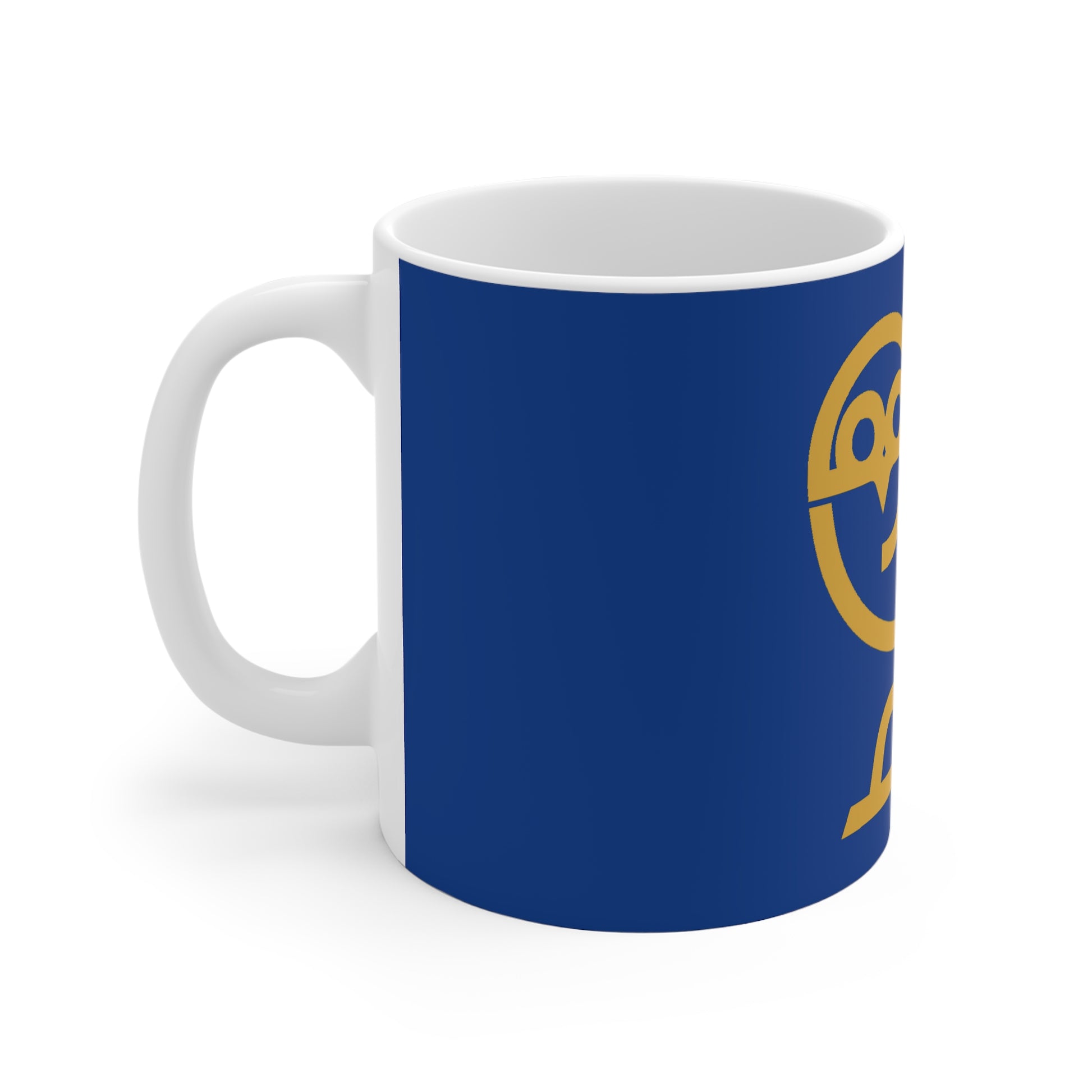 White ceramic mug with blue background and partial yellow owl logo design
