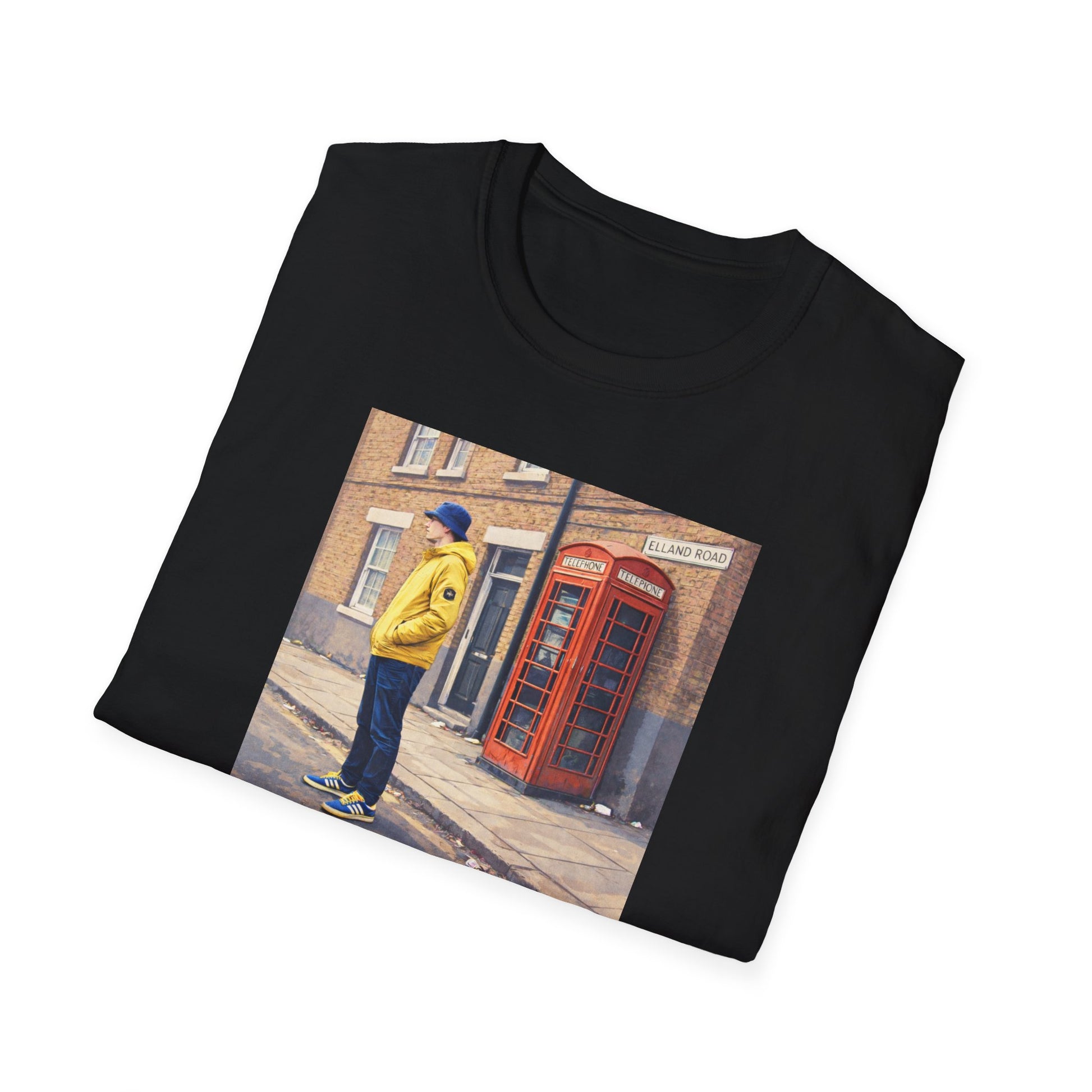 Folded Black Leeds t-shirt featuring a football casual print of a man in a yellow jacket and blue hat by a classic red British phone booth on Elland Road