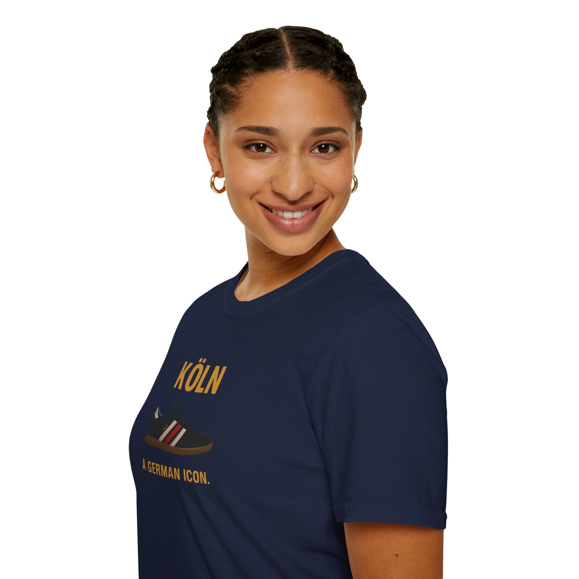 Smiling woman with braided hair wearing navy blue Köln t-shirt with sneaker graphic and text