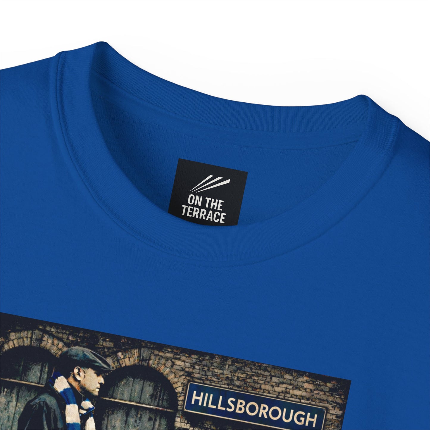 A close up image of a Blue Sheffield Wednesday FC inspired t-shirt with vintage graphic of a fan in flat cap