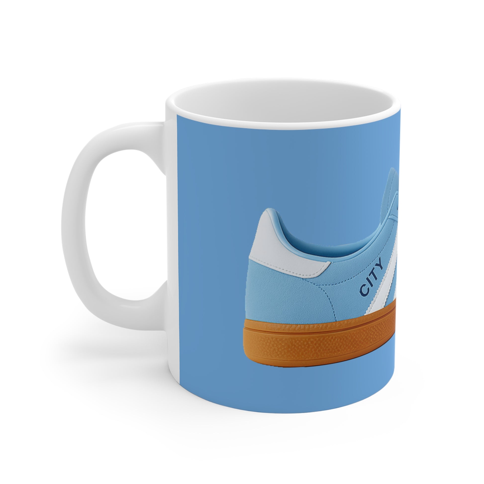 White mug featuring a blue sneaker with gum sole and the word CITY on a blue background