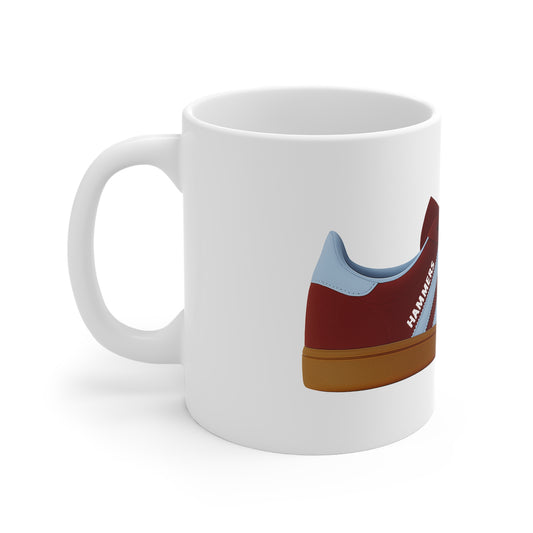 White ceramic mug featuring a red and blue sneaker with brown sole and HAMMERS text