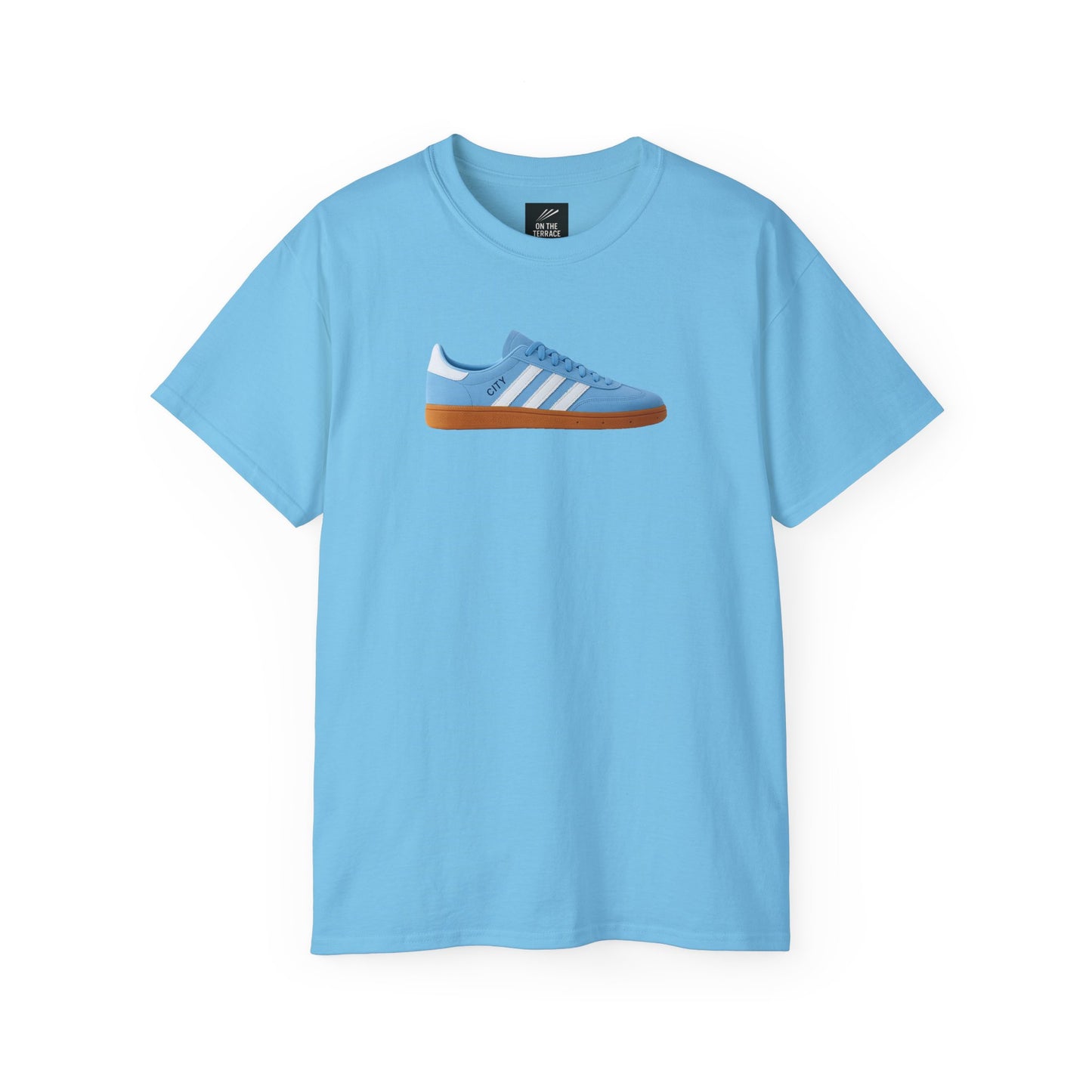 Light blue t-shirt with a graphic of a blue sneaker with white stripes and gum sole on front