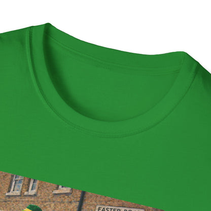 Close-up of a green shirt with a brick wall and sign in the background