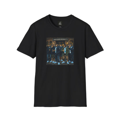 Black t-shirt with a graphic of chimpanzees dressed as Manchester City fans in scarves and parkas standing outside a pub called "The Northern Monkey's."