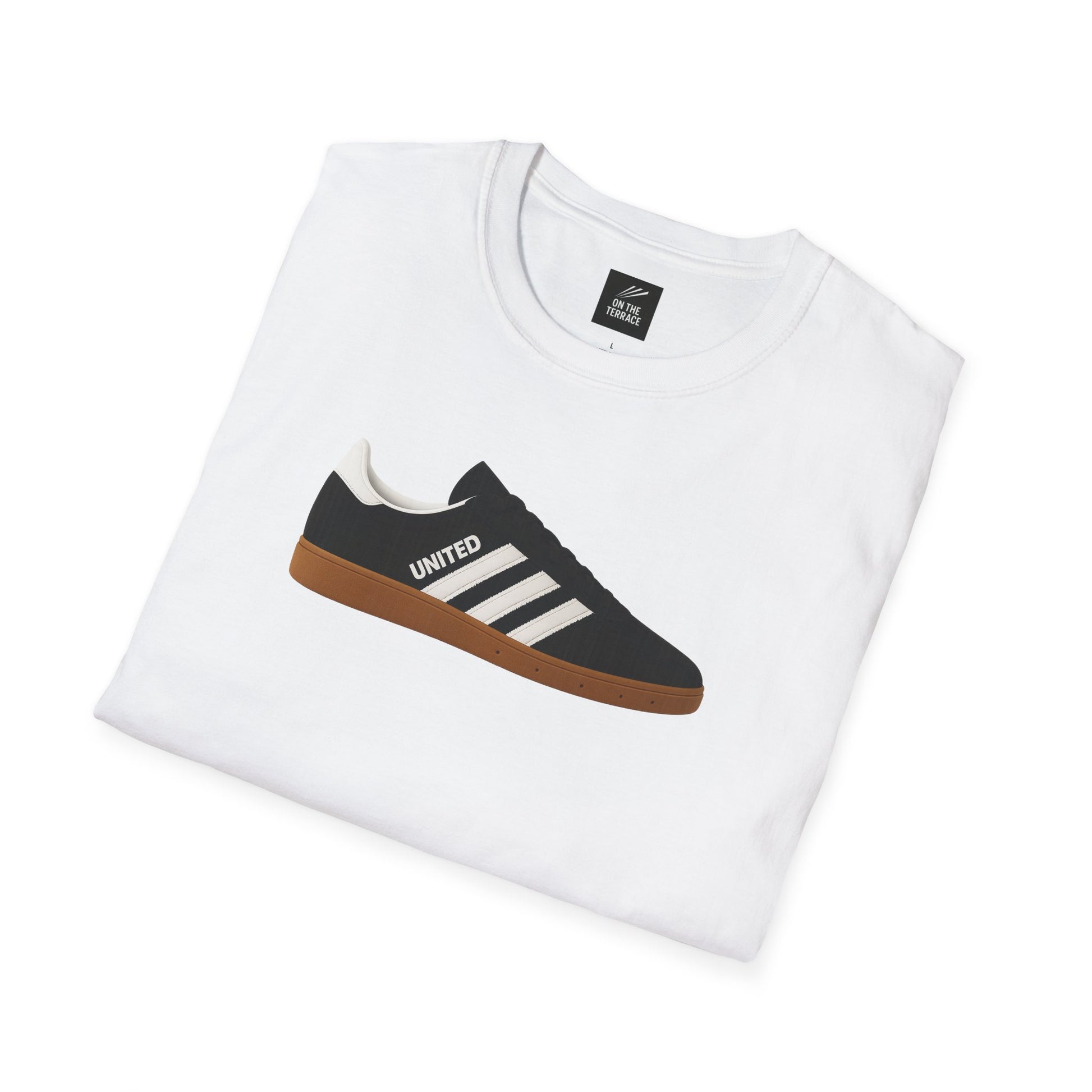 White folded t-shirt with printed black sneaker graphic featuring white stripes and word UNITED
