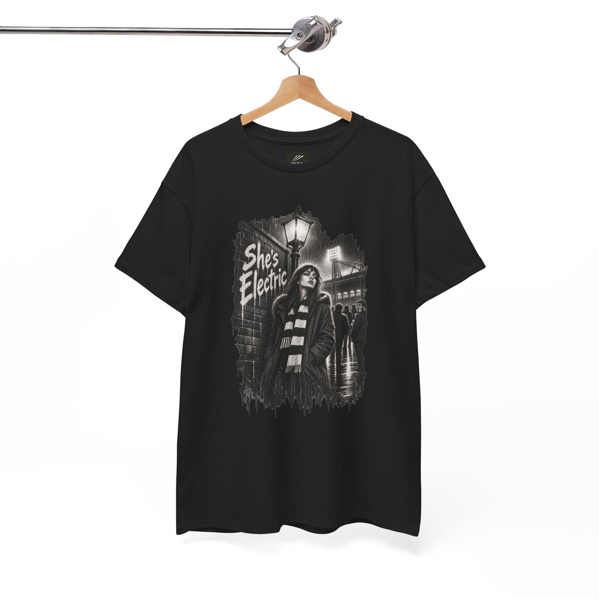 Black Oasis She's Electric T-shirt hanging on a wooden hanger