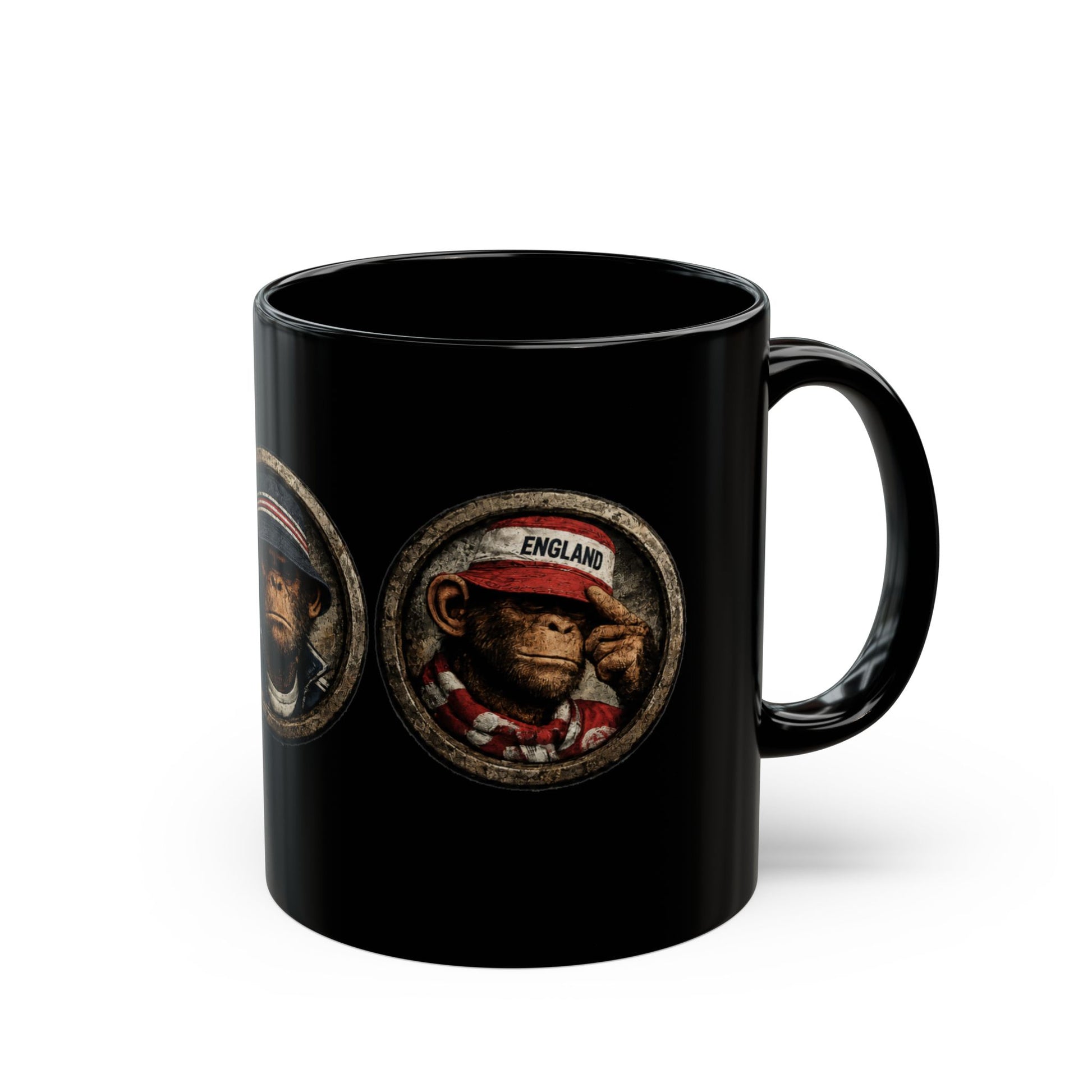 A black ceramic mug features three circular, stone-textured portrait emblems. The central emblem showcases a chimpanzee with a stern expression, wearing a navy blue casual jacket and a navy bucket hat with red and white stripes. The left emblem shows a monkey wearing an England St. George's cross bucket hat and a blue-and-white bar scarf. The right emblem shows a monkey in a red casual cap and scarf.