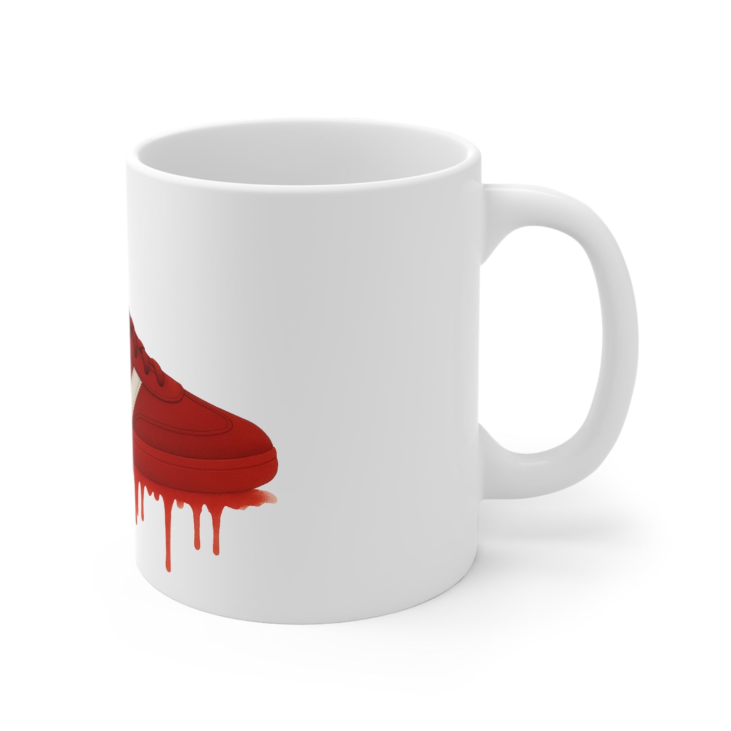 White ceramic mug featuring red sneaker illustration with paint drip effect on side