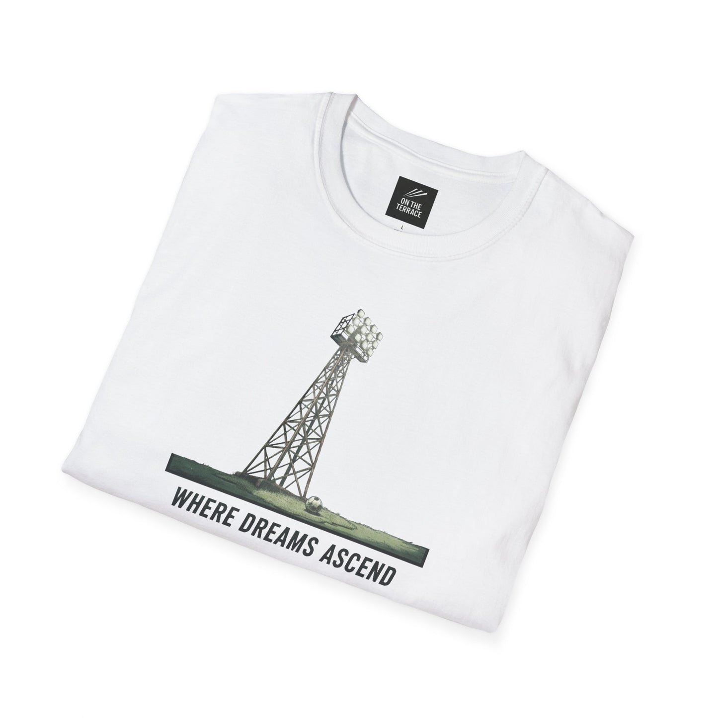 White folded t-shirt with graphic of a stadium floodlight tower and text 'Where Dreams Ascend'