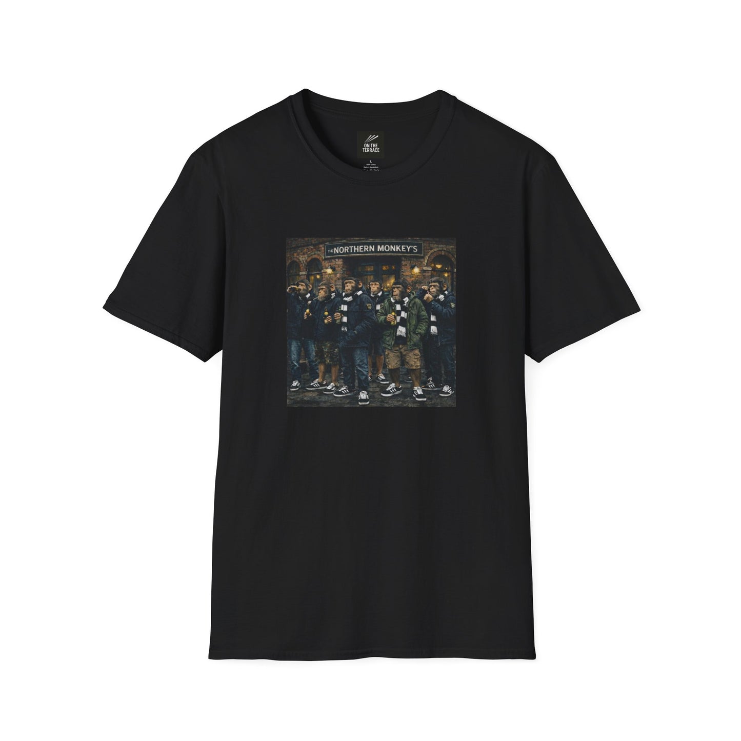 A black, short-sleeved crewneck t-shirt featuring a large, colorful rectangular graphic on the chest. The artwork depicts a group of seven chimpanzees standing in front of a traditional brick pub with a sign that reads "THE NORTHERN MONKEY'S". The monkeys are dressed in classic British "terrace culture" or "football casual" fashion, wearing olive and navy parkas, puffer jackets, black-and-white striped scarves, and black  trainers with white stripes. Some of the figures are shown holding bottles.