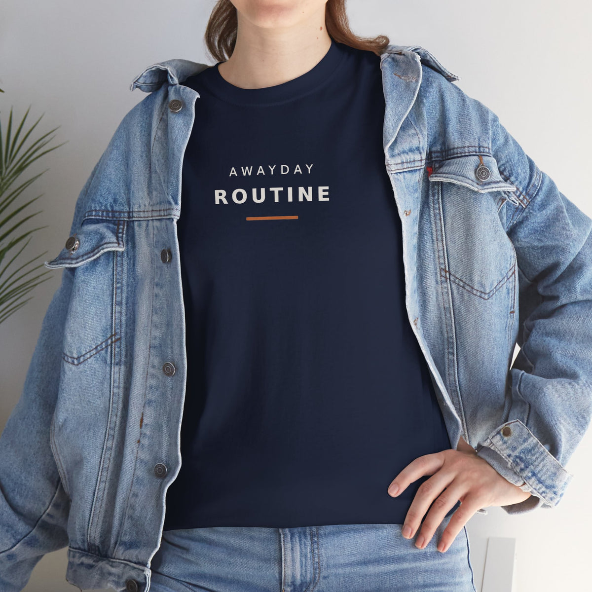 Woman in a denim jacket wearing the navy Awayday Routine football casuals tee