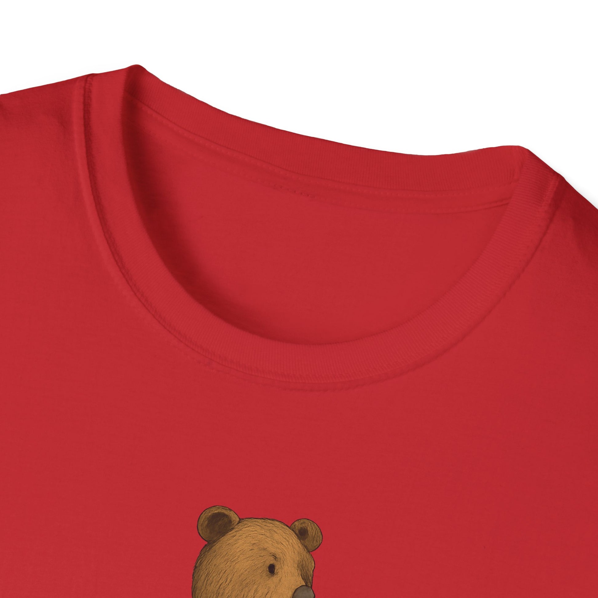 Close-up of red t-shirt neckline with a partial brown bear graphic on fabric