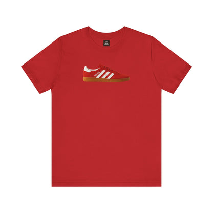 Red t-shirt with a graphic of a red sneaker featuring white stripes and gum sole