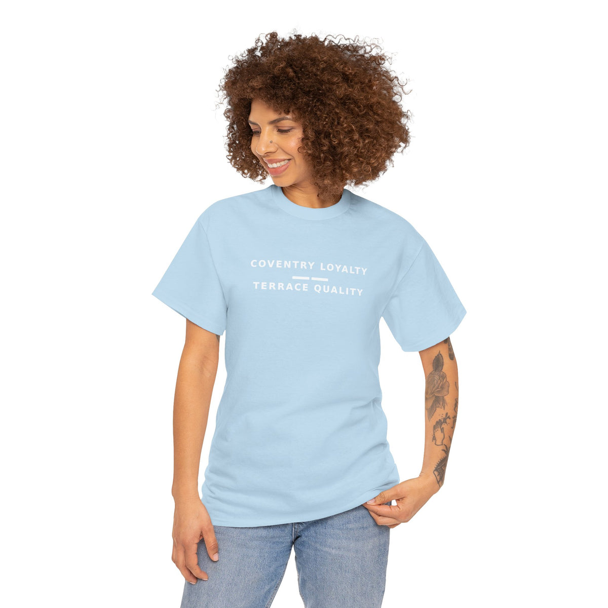 Woman wearing the sky blue Coventry Loyalty, Terrace Quality T-shirt with jeans