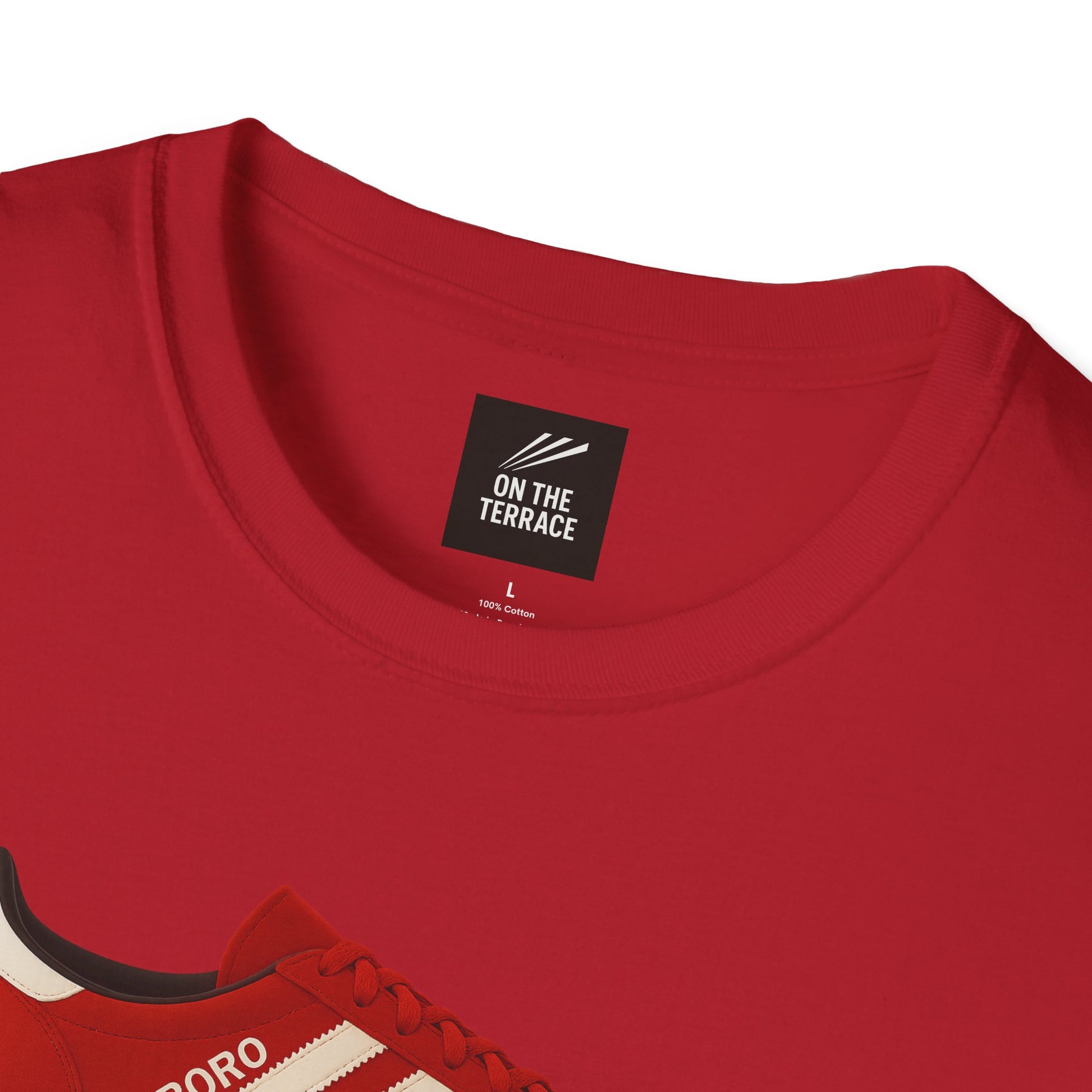 Close-up of red cotton t-shirt neckline with On The Terrace label and partial red sneaker design