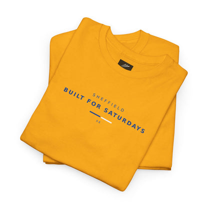Folded gold tee showing Sheffield Built For Saturdays in navy with blue and white bar and S6
