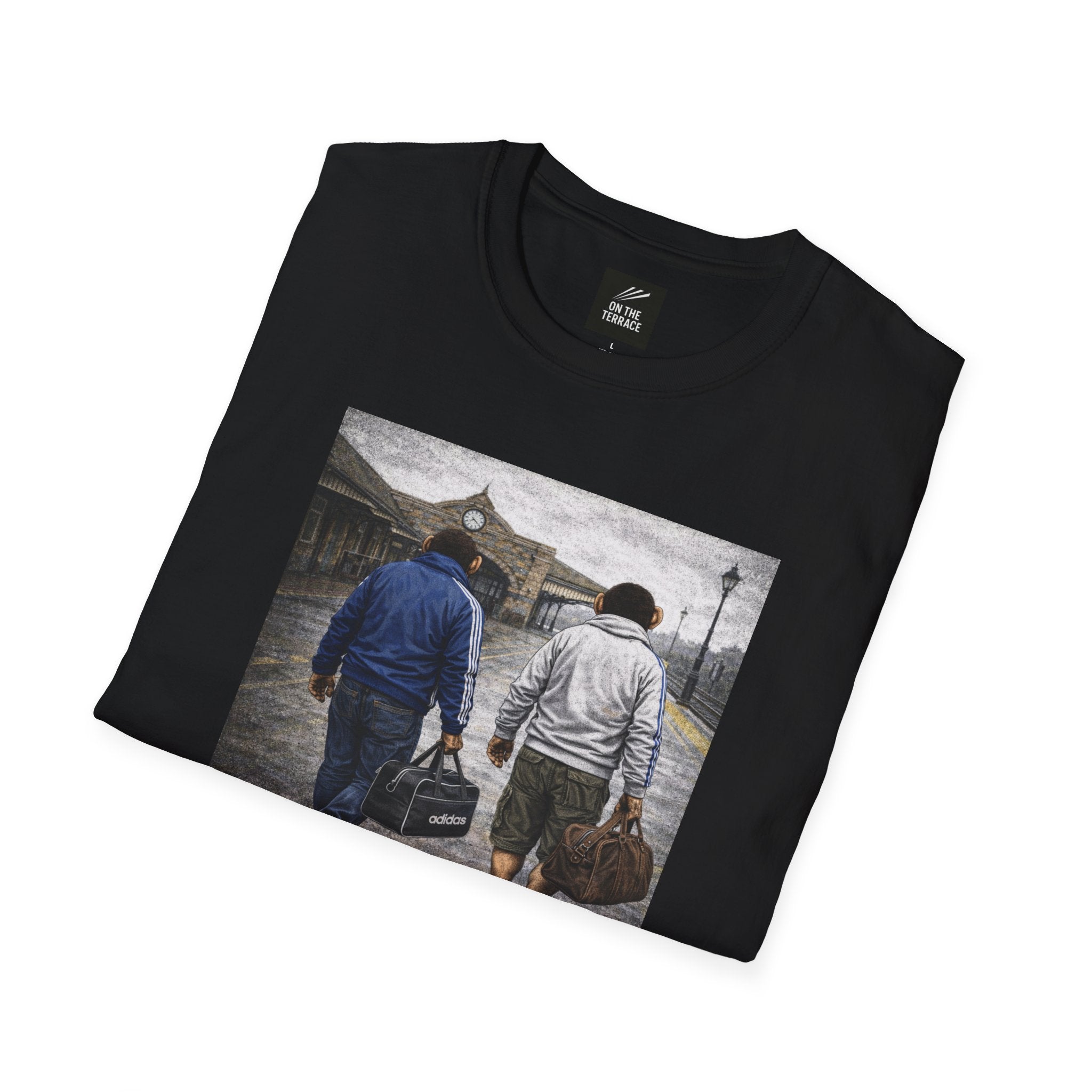 "On The Terrace" black tee featuring a nostalgic "Northern Monkeys" graphic of two chimps in classic match-day casual wear heading toward the station for an away day.