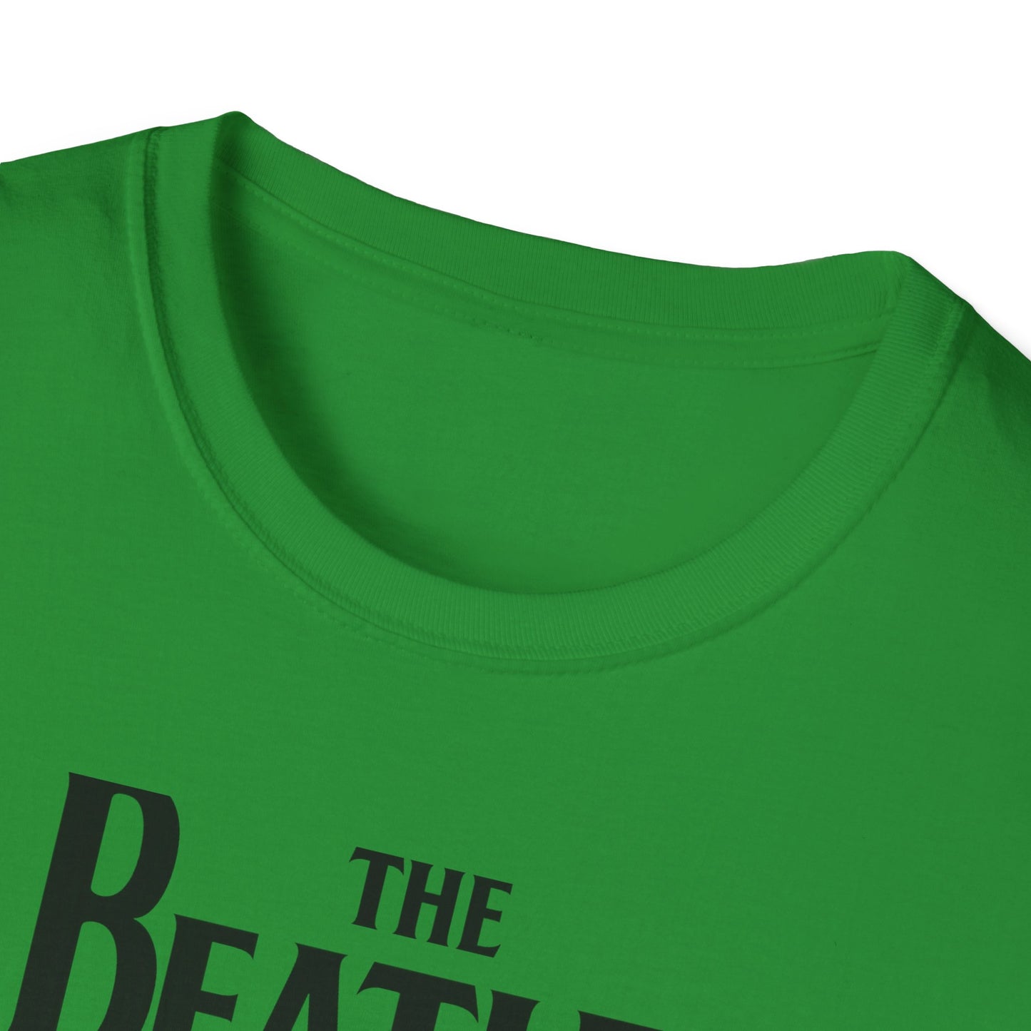 Close up of a t-shirt with 'The Beatles' logo on a white background