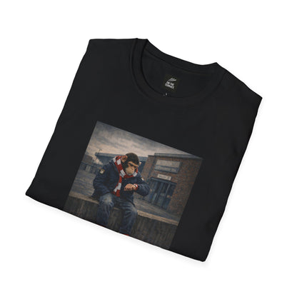 Folded black northern monkeys t-shirt with a graphic of a person on a white background