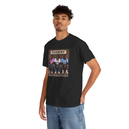 Man wearing the black Coventry Monkeys graphic T-shirt with jeans