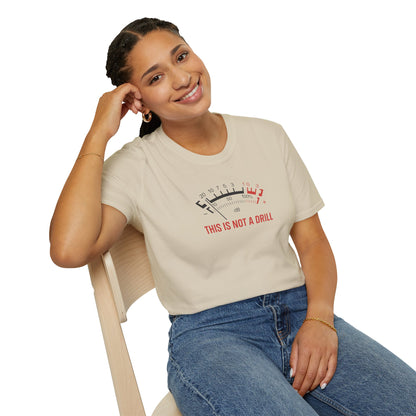 Smiling woman in casual t-shirt with meter graphic and 'This Is Not A Drill' text, seated on chair