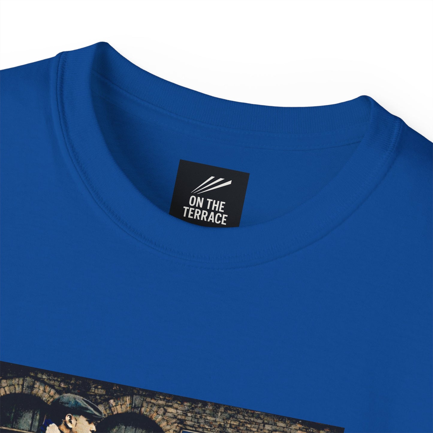 Blue t-shirt with 'On The Terrace' label on a white background