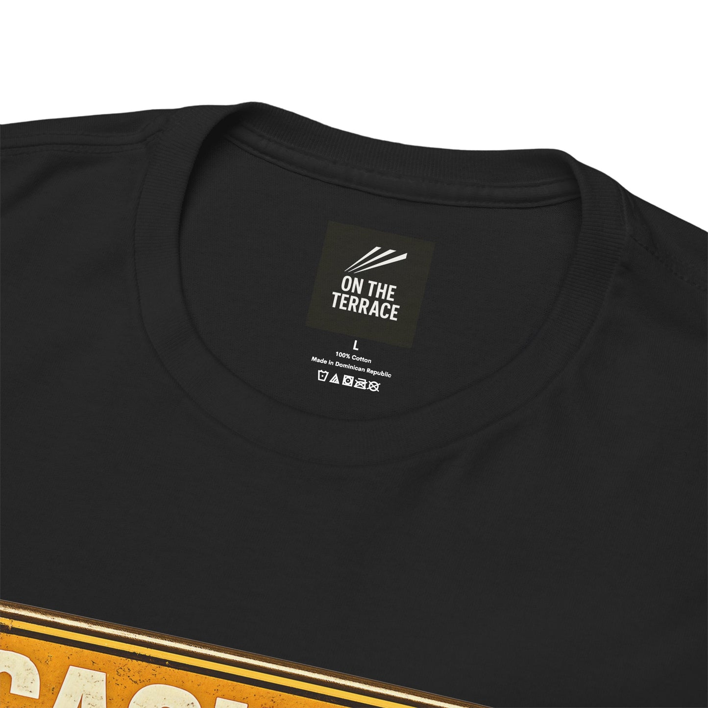 Close-up of a black HULL CITY t-shirt showing the inner neck label which reads 'ON THE TERRACE' and a partial graphic at the bottom with gold and white lettering.