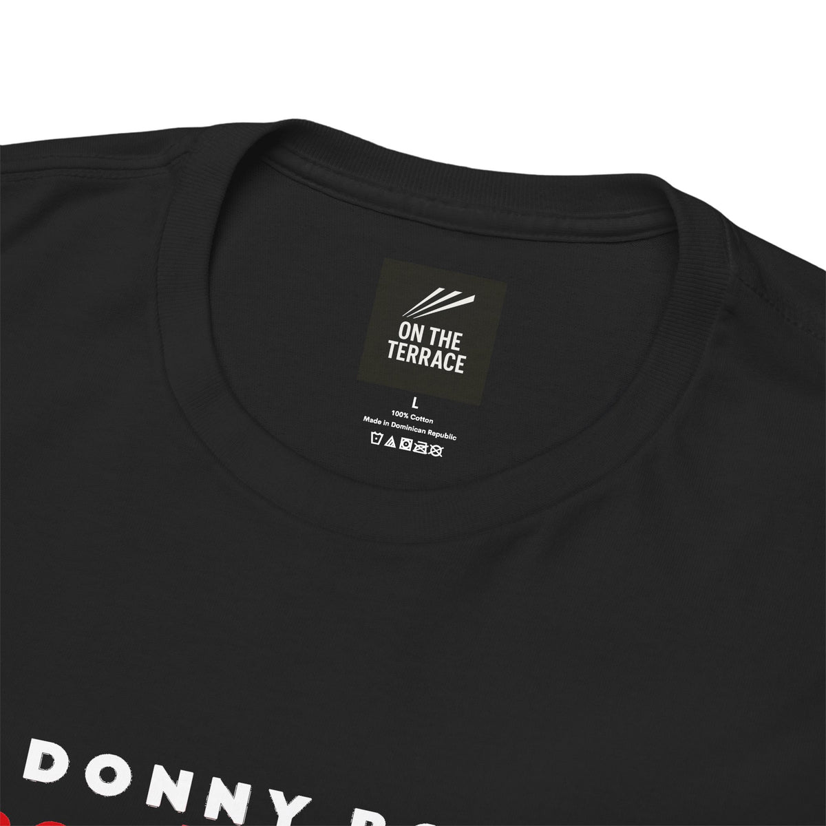 Close-up of On The Terrace neck label on black heavy cotton Doncaster Rovers tee