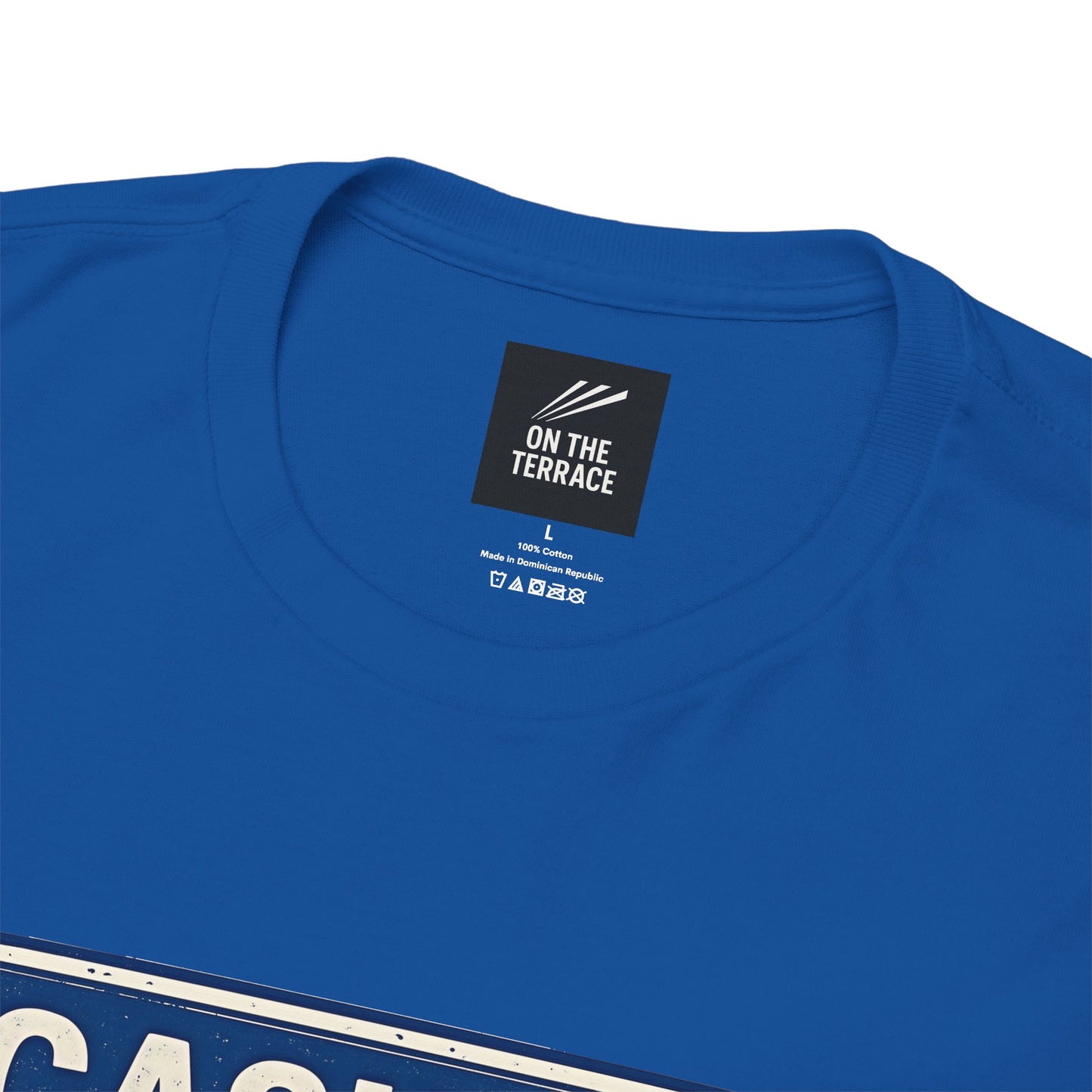Close-up of a royal blue crewneck SWFC t-shirt showing the inner neck label which reads 'ON THE TERRACE'.