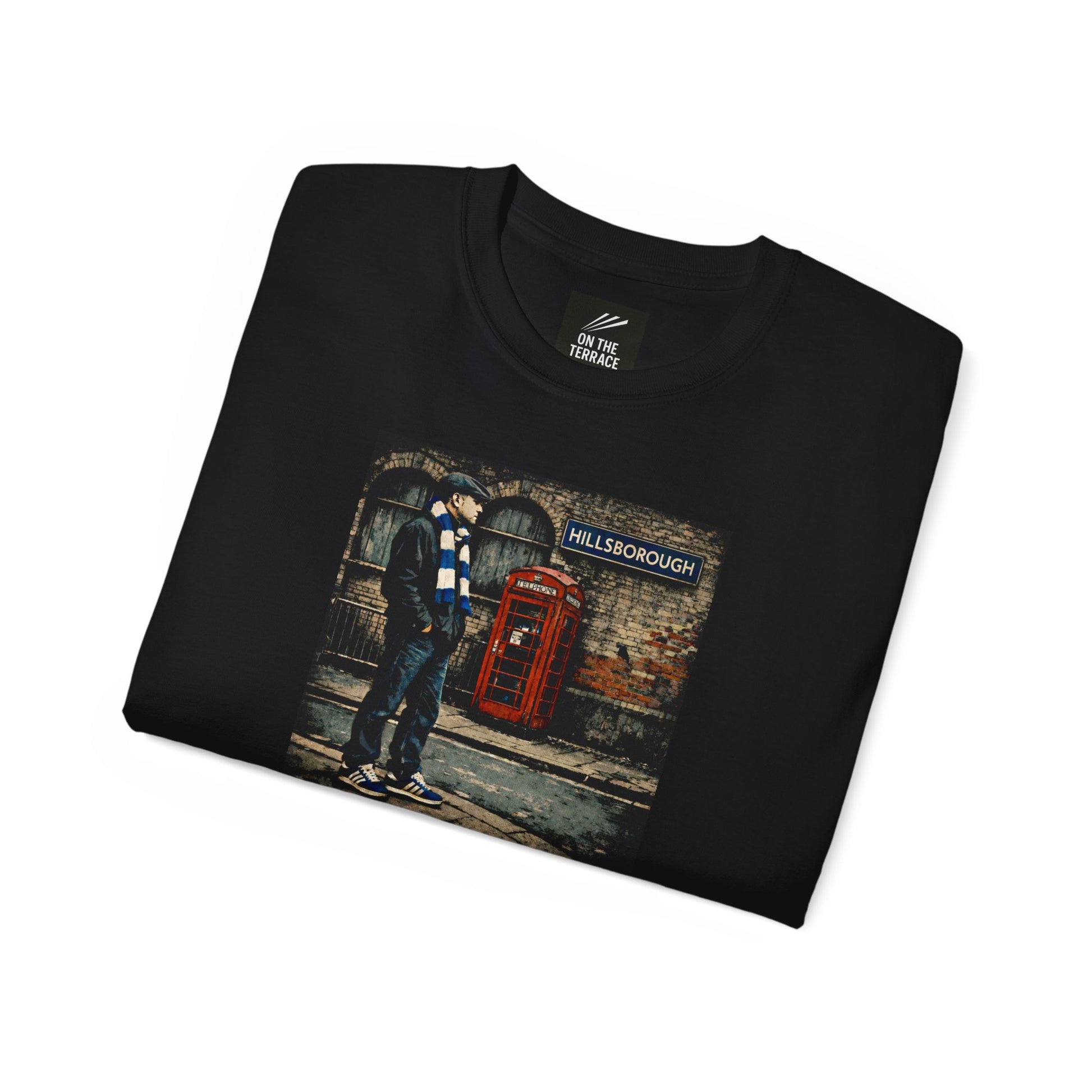 Folded Black Sheffield Wednesday FC inspired t-shirt with vintage graphic of a fan in flat cap