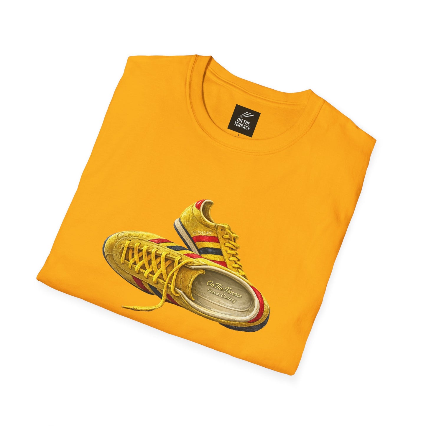 A folded bright Gold t-shirt with hand-illustrated yellow, navy and red retro terrace trainer sneaker graphic print, On The Terrace casual clothing brand
