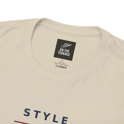 Close-up of On The Terrace neck label and navy STYLE lettering on sand tee
