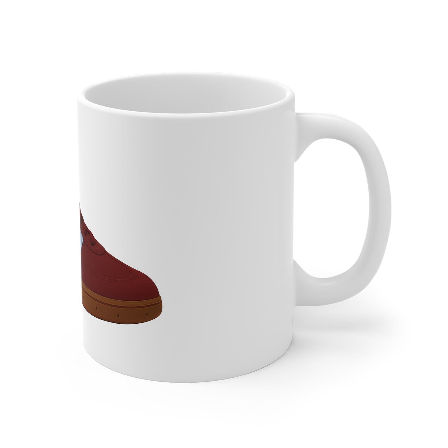 White ceramic mug with a red sneaker graphic and brown sole design
