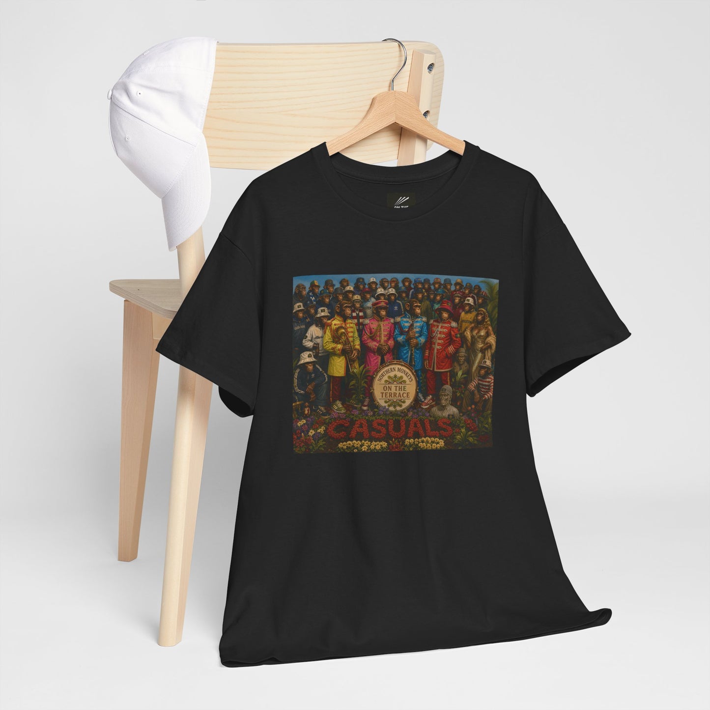 Detail view of Beatles-inspired Sgt. Pepper Casuals graphic on black T-shirt