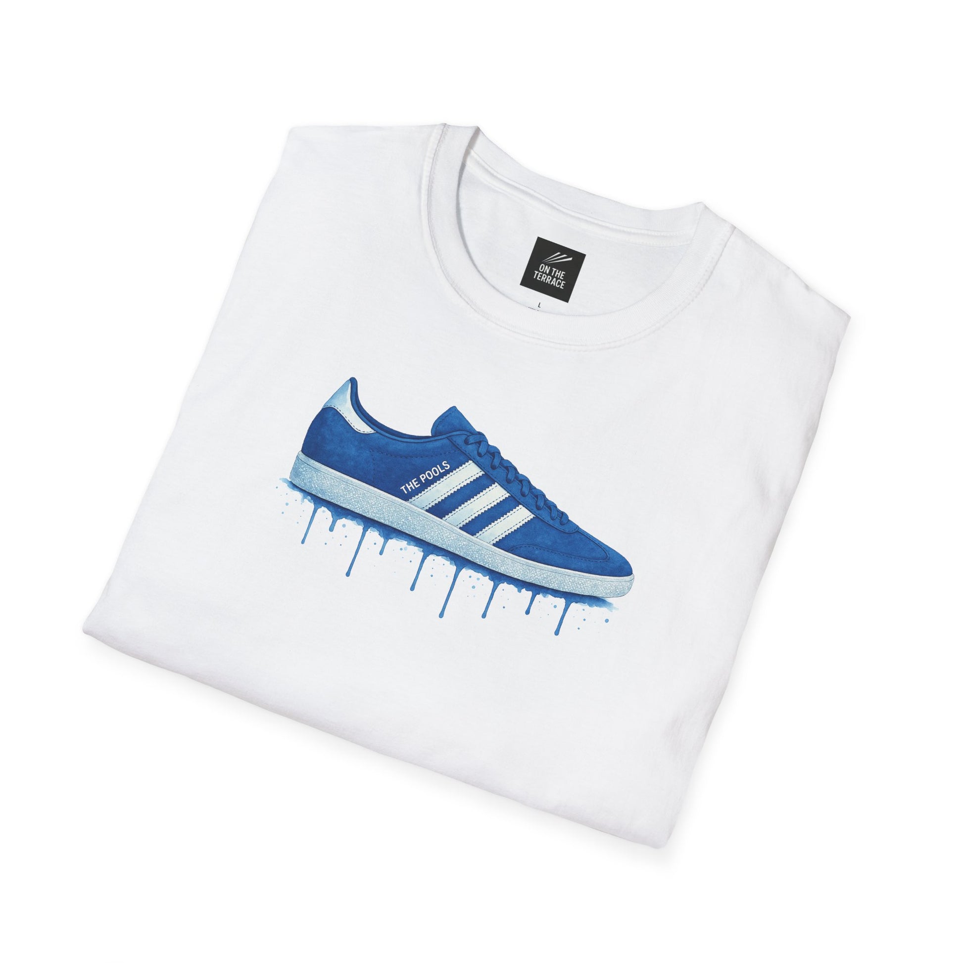 White folded t-shirt with blue sneaker graphic and text 'THE POOLS' on the shoe