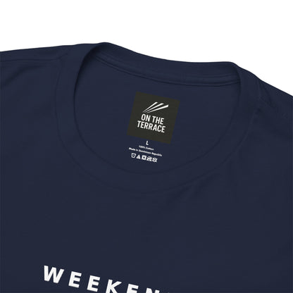 Close-up of the On The Terrace neck label and Weekend Tactics print on the navy tee